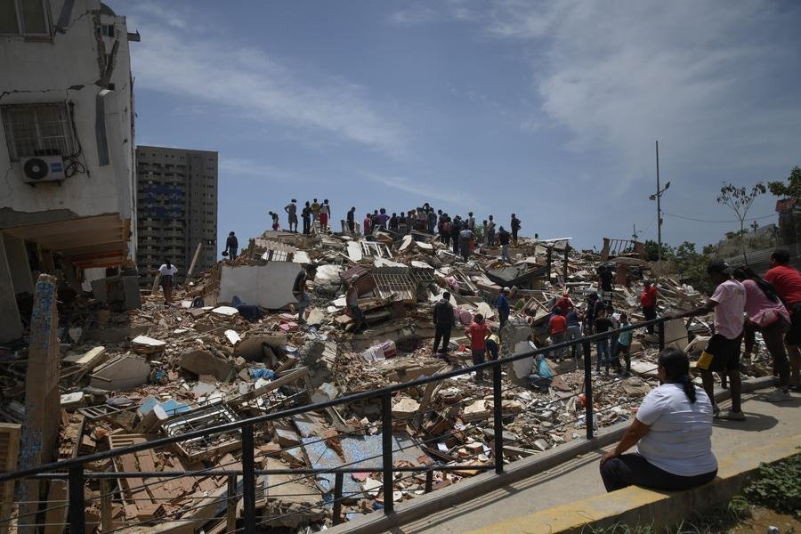 Rescue workers search collapsed buildings after a fresh earthquake struck Venezuela following deadly twin quakes